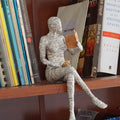 Reading woman resin statue in b