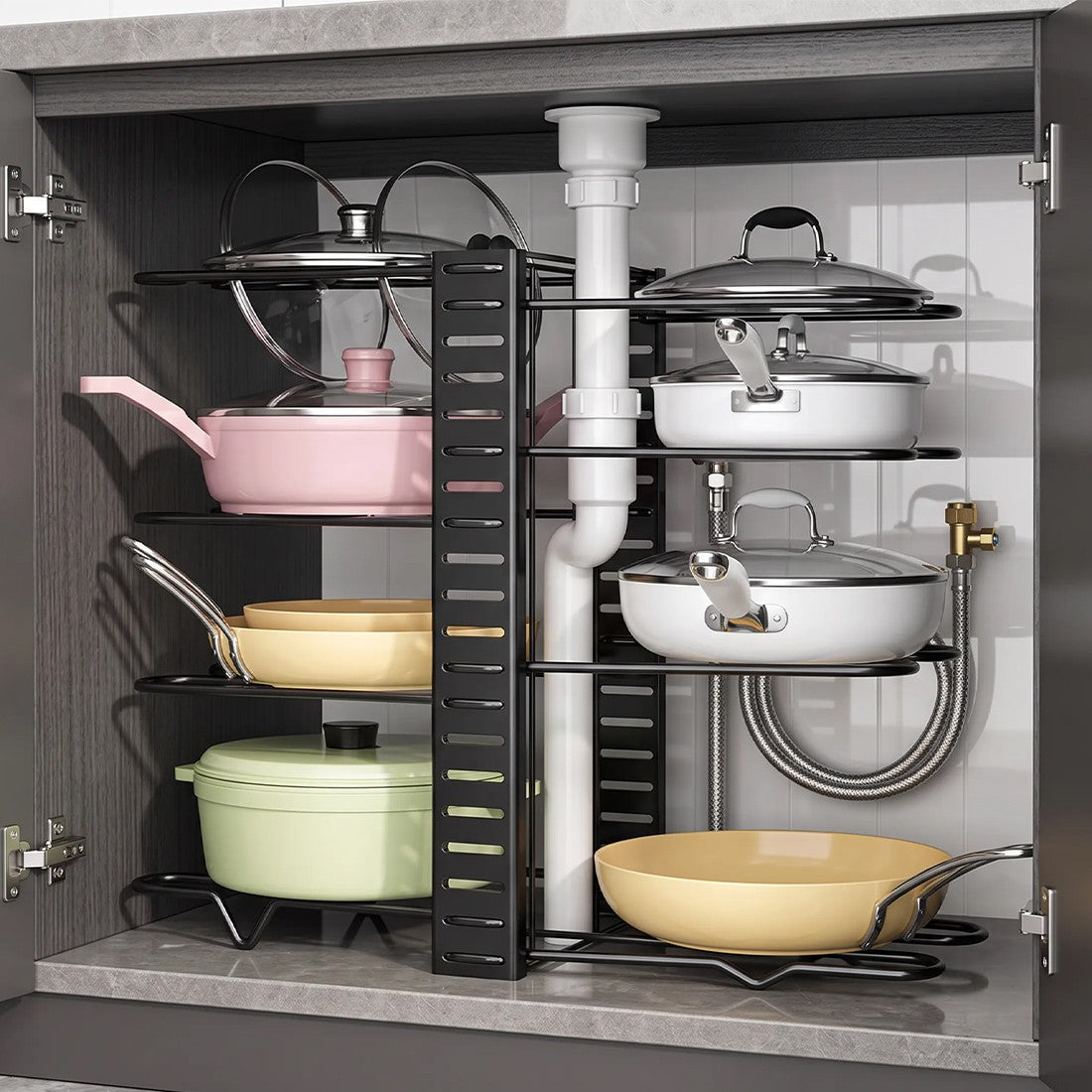 Black adjustable pan organiser rack under a kitchen sink
