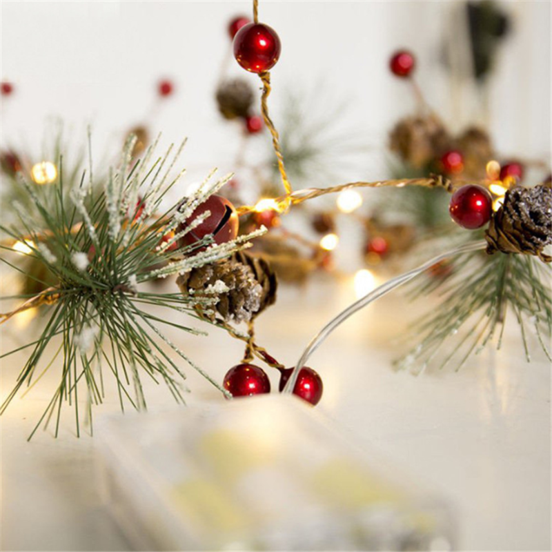 Pine cone and berry fairy lights close-up