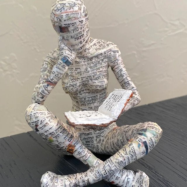 Reading woman resin statue in confidence