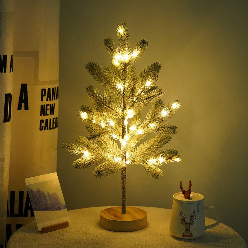 Frosted pine Christmas tree lamp glowing warm white