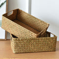 Two woven seagrass storage baskets stacked