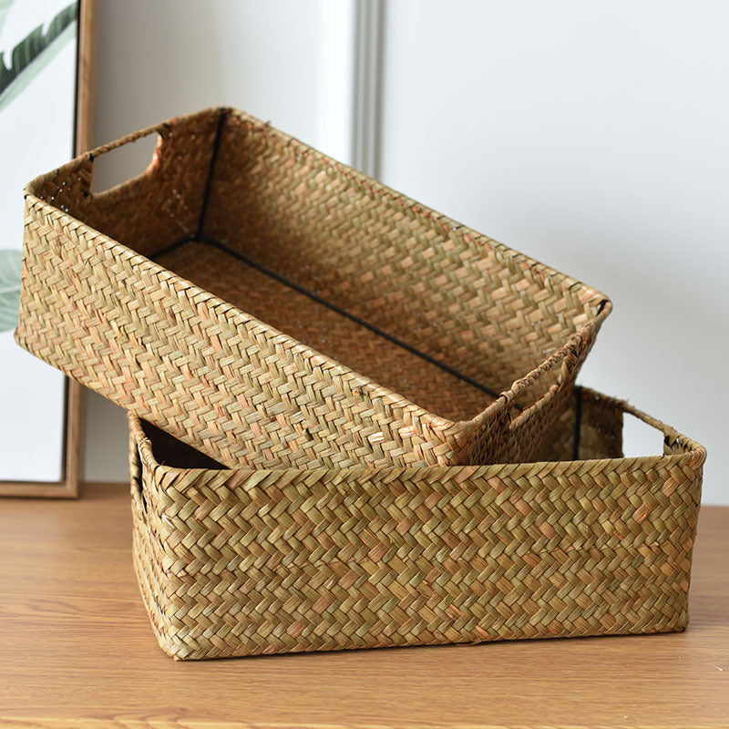 Two woven seagrass storage baskets stacked