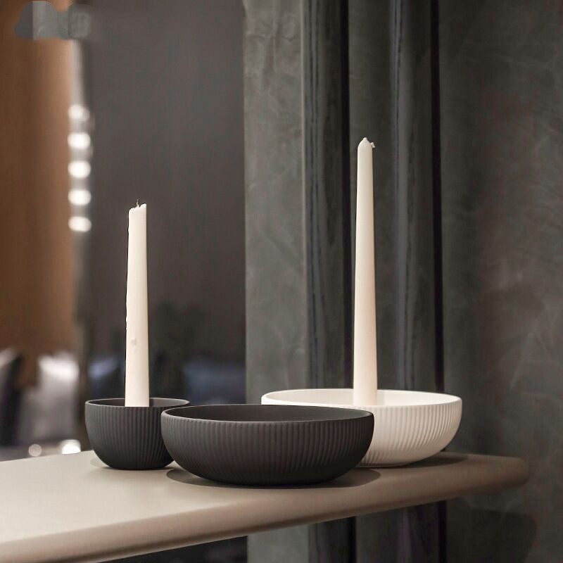 Minimal ceramic candle trays in fluted matte porcelain styled with taper candles
